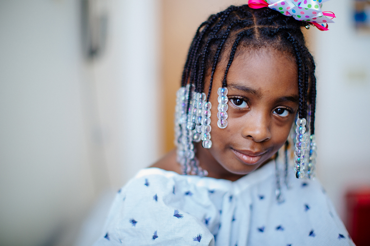 patient with braids and beads