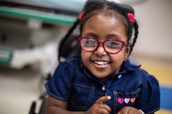 Young Girl Smiling in Wheelchair