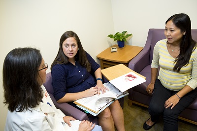 An expectant mother meets with staff from the Fetal Medicine Institute
