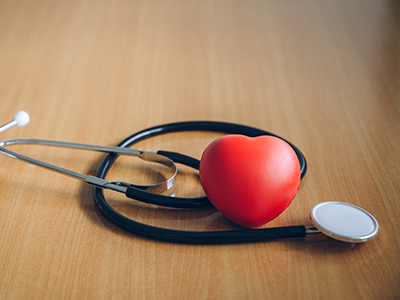 stethoscope and stress ball in heart shape