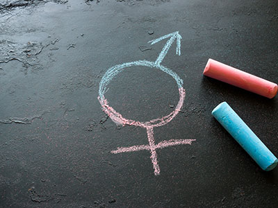 blue and pink chalk transgender symbol