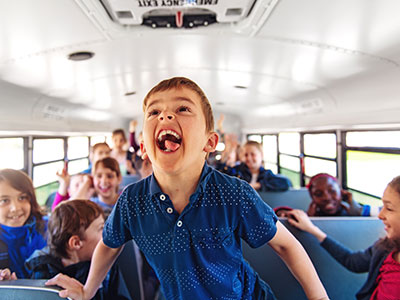 school kids on a bus