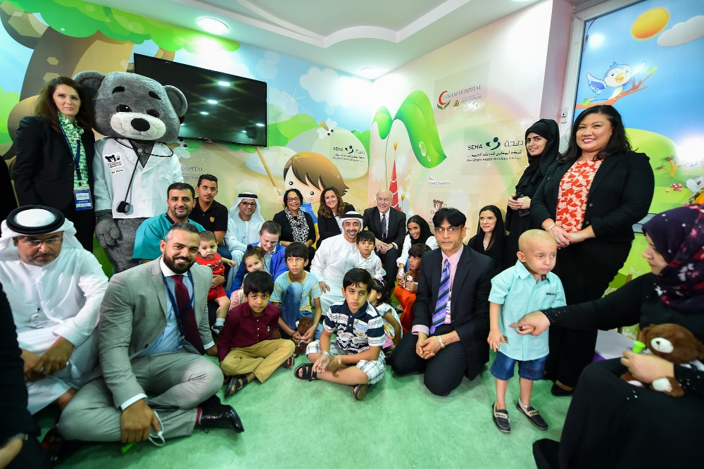 His Highness Sheikh Abdullah with children and providers and Dr. Bear