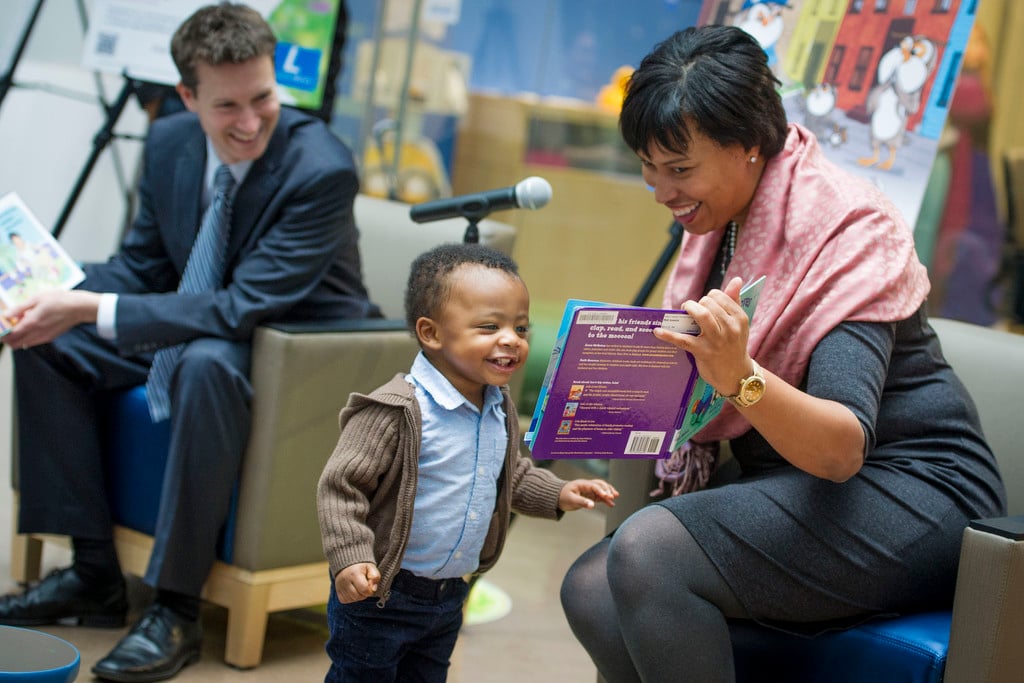 Mayor Muriel Bowser reads to an enthusiastic young listener