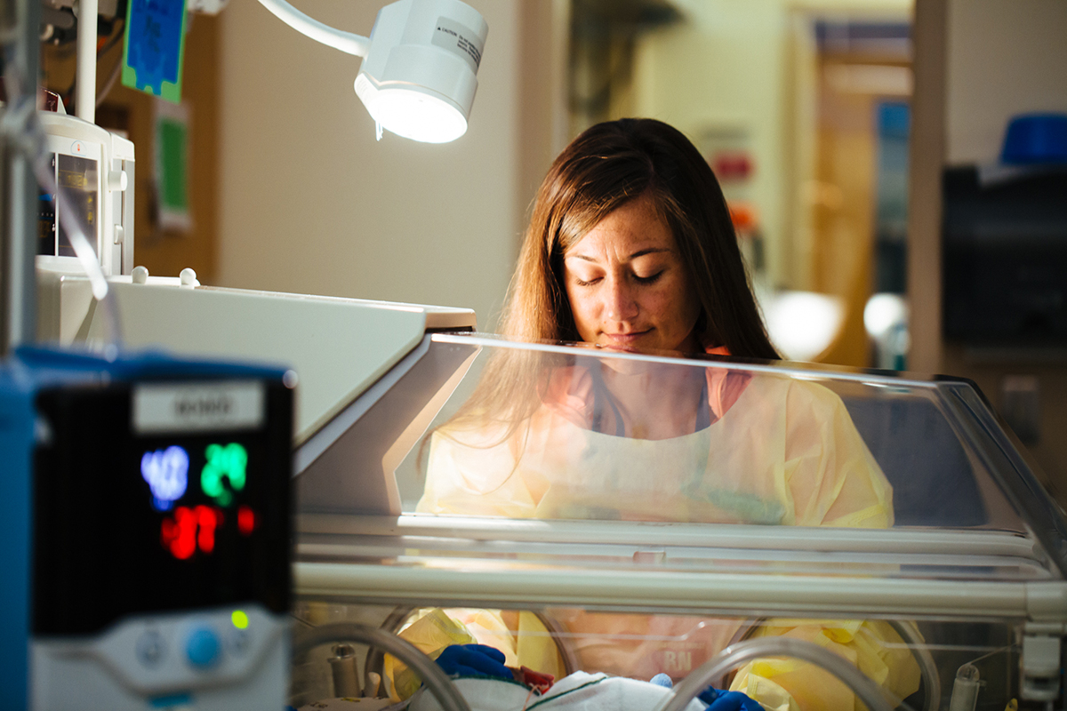 A neonatal nurse cares for a newborn in Washington DC's level 4 Neonatal Intensive Care Unit at Children's National.