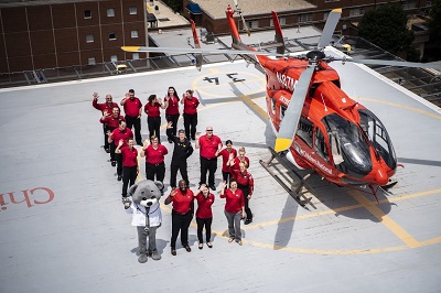 Children's National Sky Bear Transport Team on the hospital rooftop helipad next to helicopter