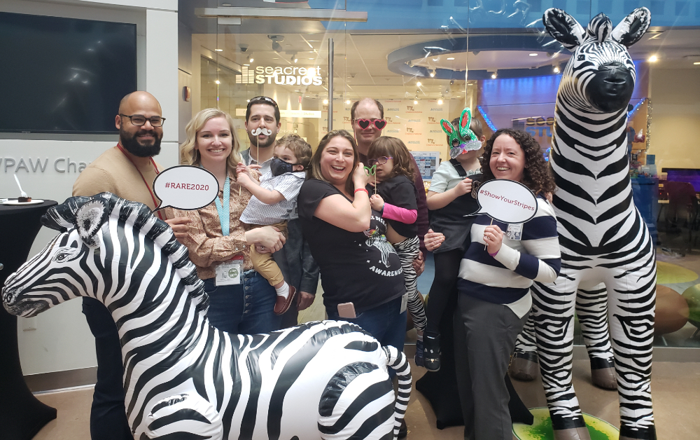 family with toy zebras