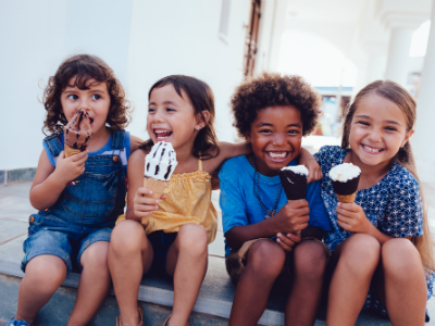 four young girls eating ice cream