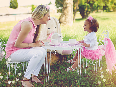 mom and daughter having tea party