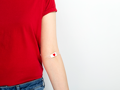 arm with heart bandaid