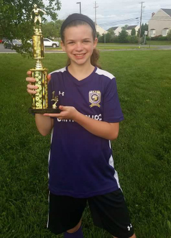 girl with soccer trophy