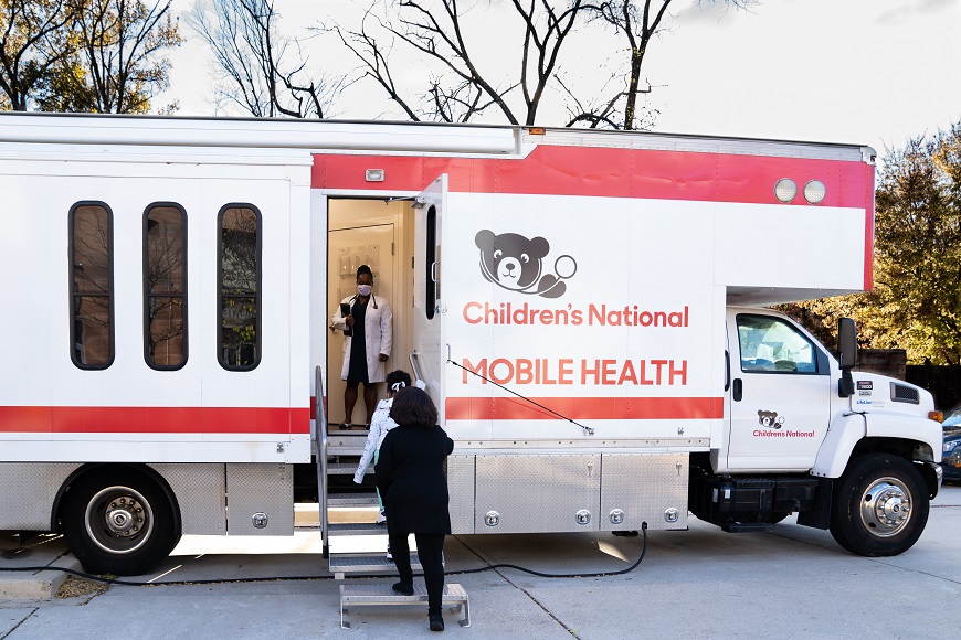 A family enters the Children's National mobile health van.
